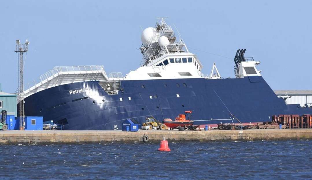 Ship capsizes in Scottish harbor