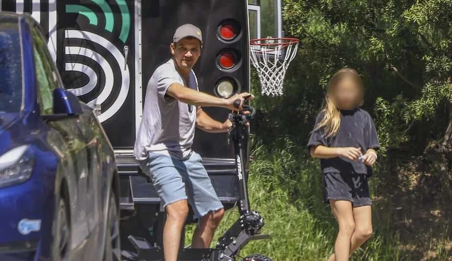 Jeremy Renner is seen riding a scooter with his daughter
