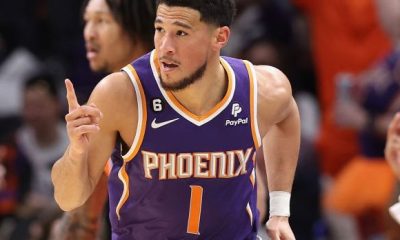 Booker leads Suns and is praised