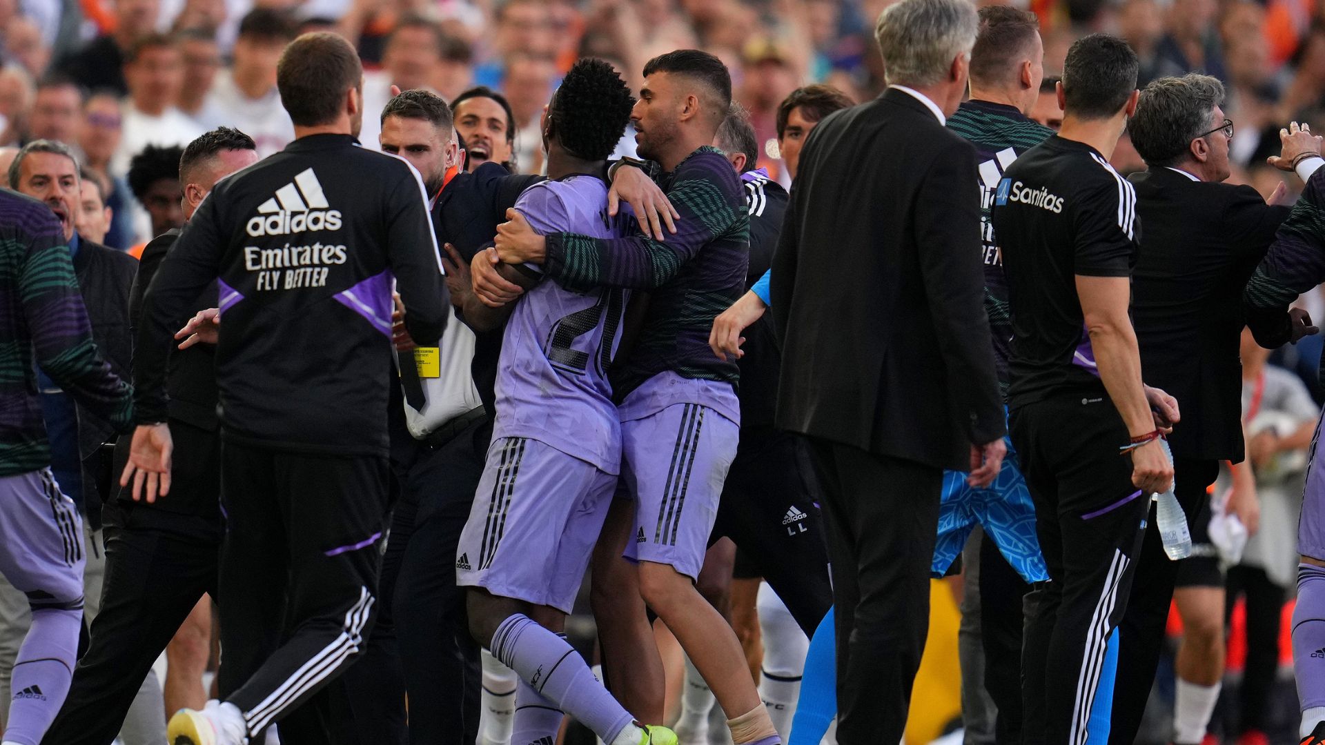 Vini Jr leaving the pitch restrained by his Real Madrid teammates (Credit: Getty Images)