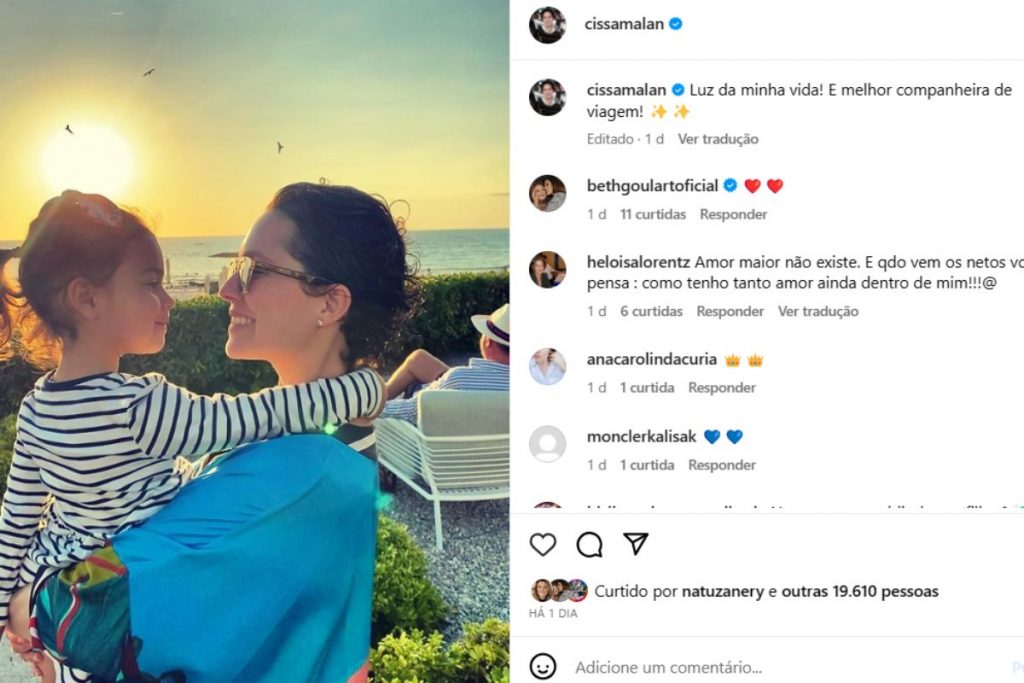 Cecília Malan with her daughter, with the sunset in the background