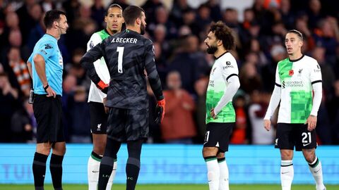 Alisson and Salah talking during a match against Luton Town (Credit: Getty Images)