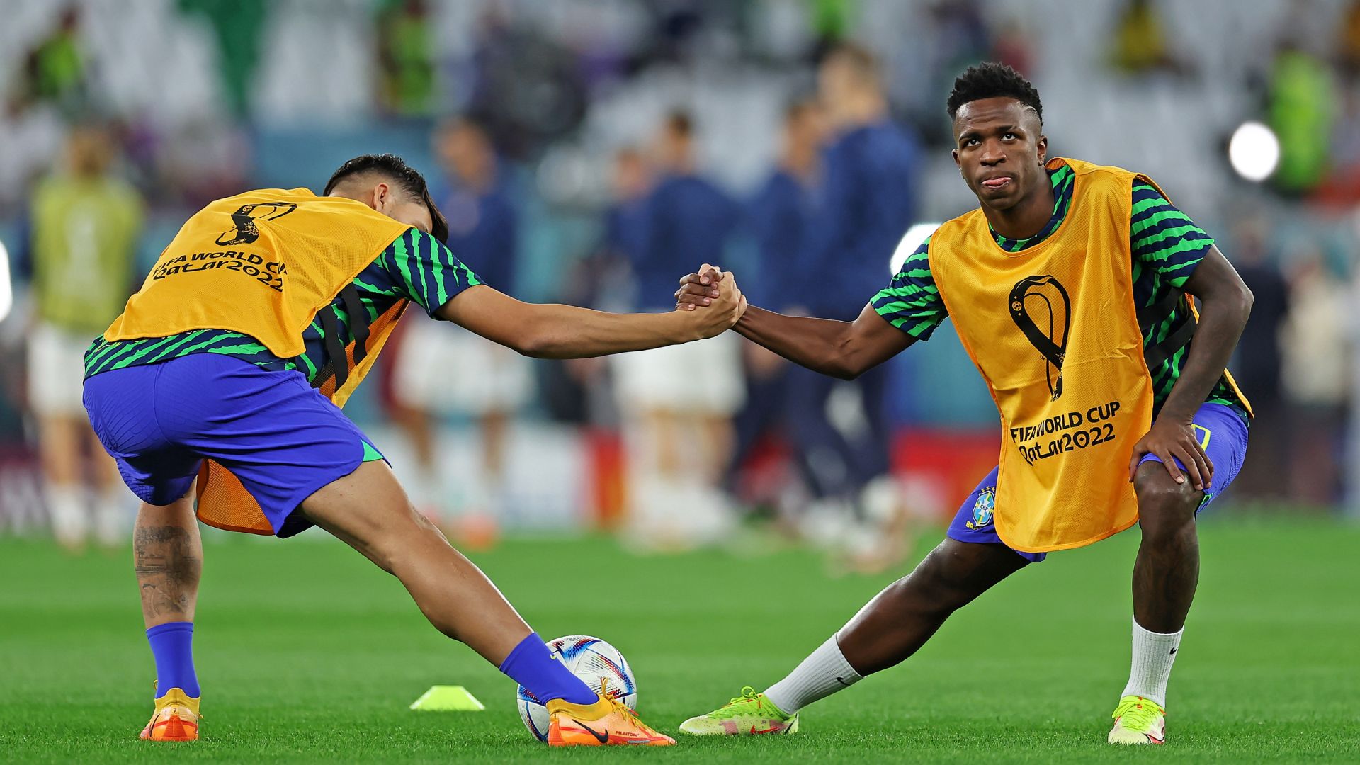 Paquetá and Vinicius Júnior stretching together, at the World Cup in Qatar (Credit: Getty Images)