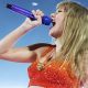 Taylor Swift appears in costume with Kansas City Chiefs colors