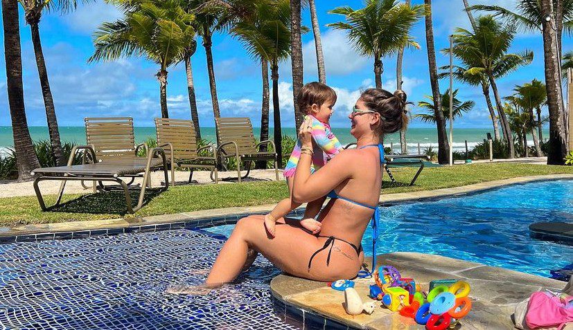 5 months pregnant, Virginia Fonseca poses in a pool with