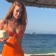 Marina Ruy Barbosa appears in an orange dress during her